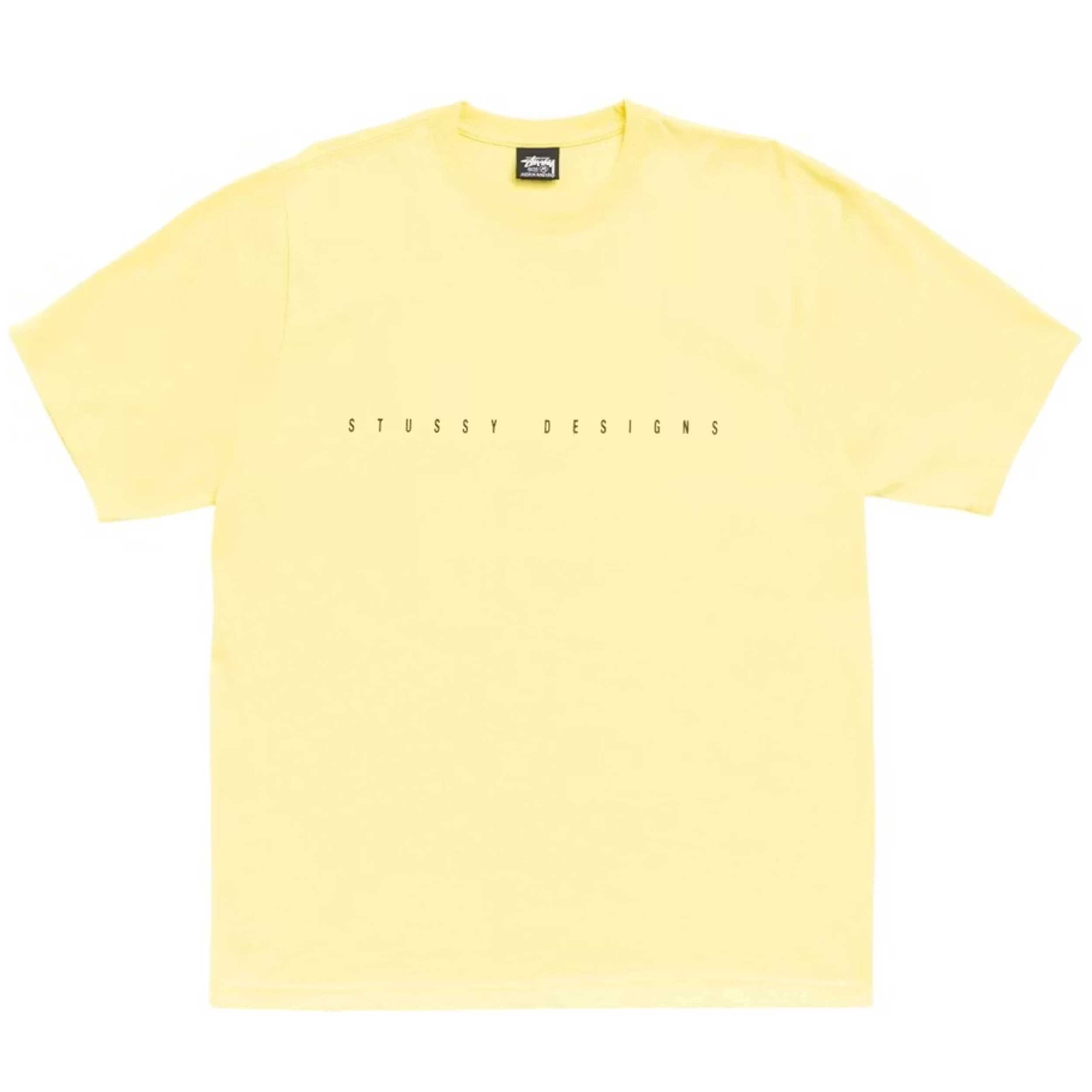 A pale yellow short-sleeve crewneck t-shirt with 'STUSSY DESIGNS' printed in small black letters across the chest, displayed flat against a white background.