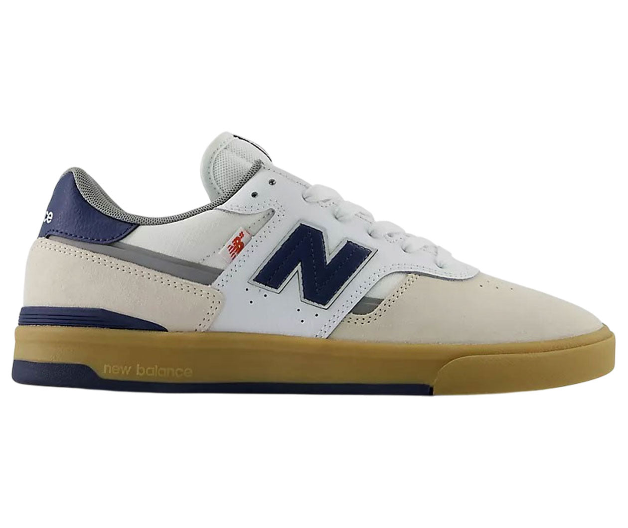 New Balance 990v3 sneaker in white suede and leather with navy blue accents, a small red logo, and a gum sole.